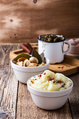 Healthy vegetarian meal. Mashed potatoes,  pickled mushrooms, sea kale salad on rustic table
