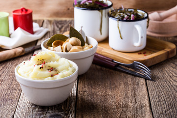 Healthy vegetarian meal. Mashed potatoes,  pickled mushrooms, sea kale salad on rustic table