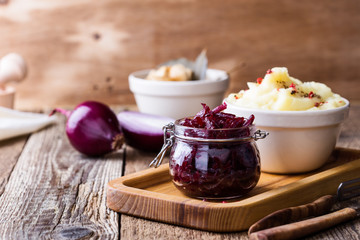 Healthy vegetarian meal. Mashed potatoes,  pickled mushrooms,  and beetroot salad on rustic table