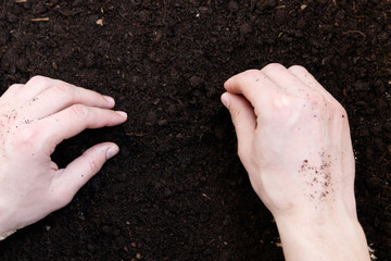 Man farmer holding soil. Earth day and ecology concept