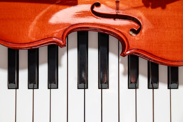 violin on the piano keys closeup look
