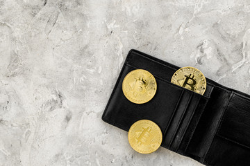 Bitcoin and wallet for online payment on gray background top view space for text