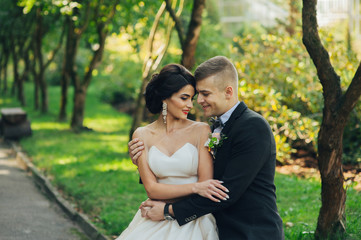 Fototapeta premium Sensual couple portrait, romantic newlywed bride and groom huggi