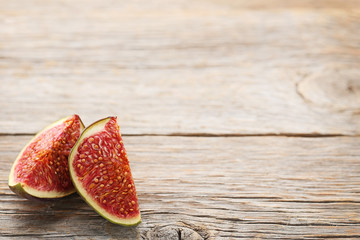 Ripe and sweet figs on wooden table