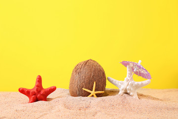 Coconut with starfish on the beach sand