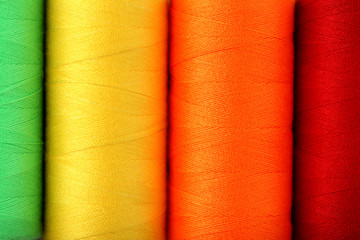 Background of colourful thread spools