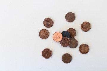 A black magnet surrounded by one-cent coins attracts some. Concept to indicate leadership, influencer and charisma. coins and magnet on a white background