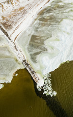 Aerial Photography of Snowy Beach With  Winter Jetty Covered in Ice