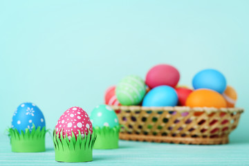 Colorful easter eggs on wooden table