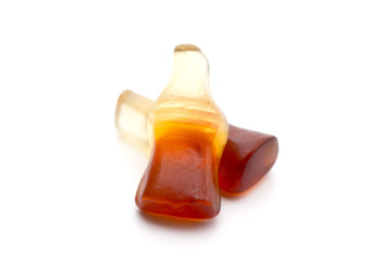 Cola Flavored Gummies on a White Background