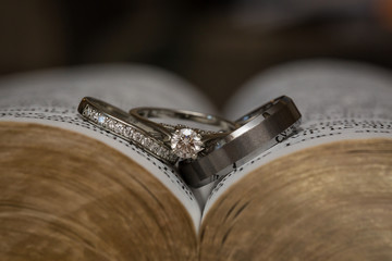 Beautiful wedding rings cradled in a bible