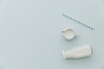 Top view of milk bottle on pastel background. Minimal creative concept. Flat lay, top view