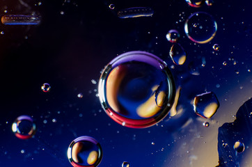 Abstract background of colorful drops and drops of water or oil on the whole frame