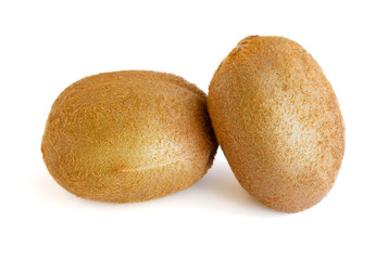 Two whole kiwi fruit isolated on a white background