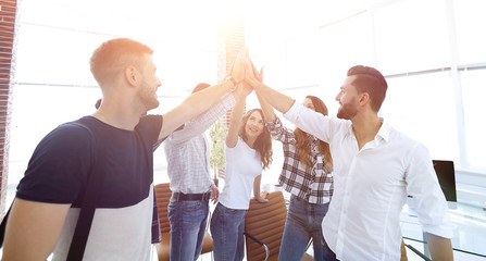 creative team giving each other a high five