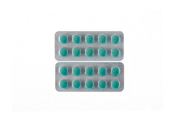 two plates of green pills on white isolated background
