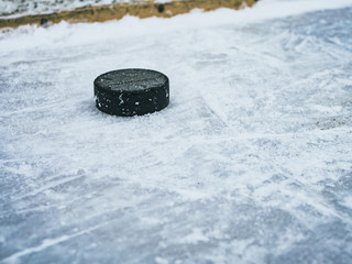 hockey puck on ice with snow texture
