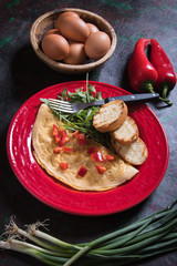 Omelet, fried chicken eggs with fresh vegetables