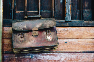 Old vintage retro antique brown leather student handback or schoolbag , Back to school background vintage retro tone concept.