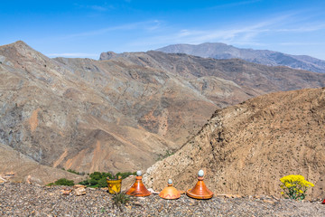 Merchants offering ceramics in the mountains of the High Atlas, Morocco, in the background serpentines