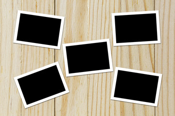 Photo frame blank on wood background with space