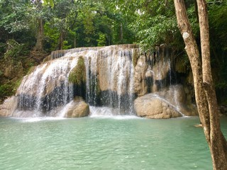Fototapeta na wymiar Erawan waterfall, tourist attraction in Thailand
