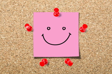 Cork board with smile sticky note