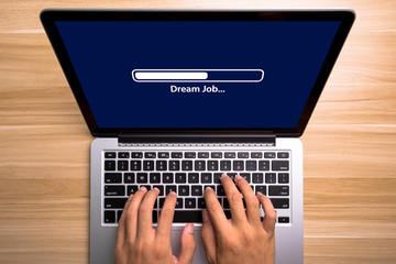 Dream Job Concept Laptop Screen With Typing Hands On Keyboard