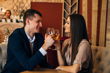 Dating concept, couple drinking wine in a restaurant