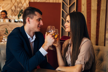 Dating concept, couple drinking wine in a restaurant