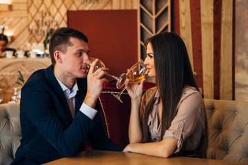 Dating concept, couple drinking wine in a restaurant