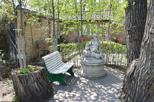 A walk on a hot summer day for a cool city Park. Alleys, benches and a pond. Russia, Siberia.