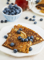 Crepes with blueberries and maple syrup