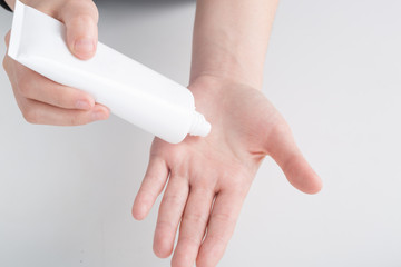 Woman's hands with care cream