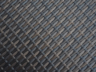 Plastic weave background looks like bamboo.