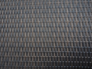 Plastic weave background looks like bamboo.
