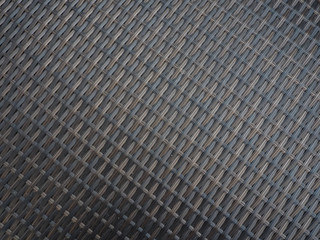 Plastic weave background looks like bamboo.