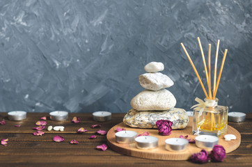 Spa composition-stones, candles, aromatherapy, dry flowers.