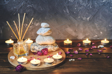 Spa composition-stones, candles, aromatherapy, dry flowers.