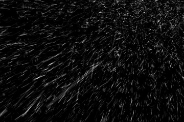 the texture of the flying snow on a black background