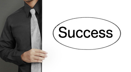 Hand holding white blank paper sheet