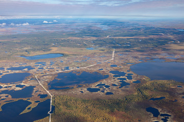 Top view of gas pipeline in endless swamps in tundra