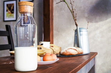 a bottle of milk on a table among the products