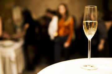 a glass of champagne on the table