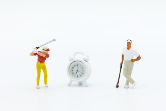 Miniature people : Businessmen spend their free time for Golf activities. Image use for sport, hobbies concept.