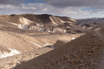 Trekking in Negev dramatic stone desert, Israel
