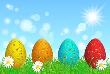 Easter eggs with golden ornament stand on grass against sky and sun
