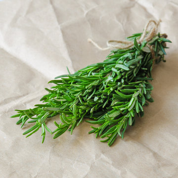 Bunch of rosemary on wrapping paper