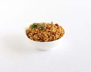 Puliyogare, south Indian traditional and popular vegetarian rice dish, made from rice and a paste containing tamarind and other ingredients.