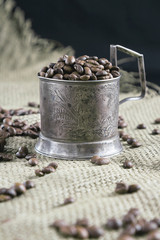 Fototapeta na wymiar Coffee and a silver cup holder